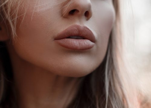 Close-up on a woman's full lips after JUVÉDERM® treatments