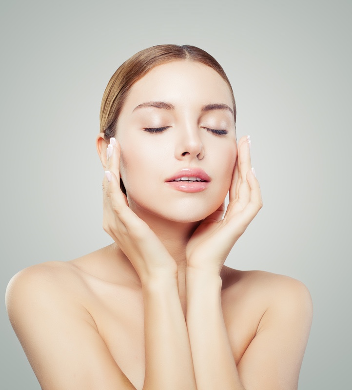 Pretty woman with closed eyes and young healthy skin.